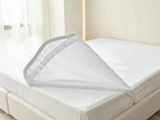 Waterproof mattress protector on a bed